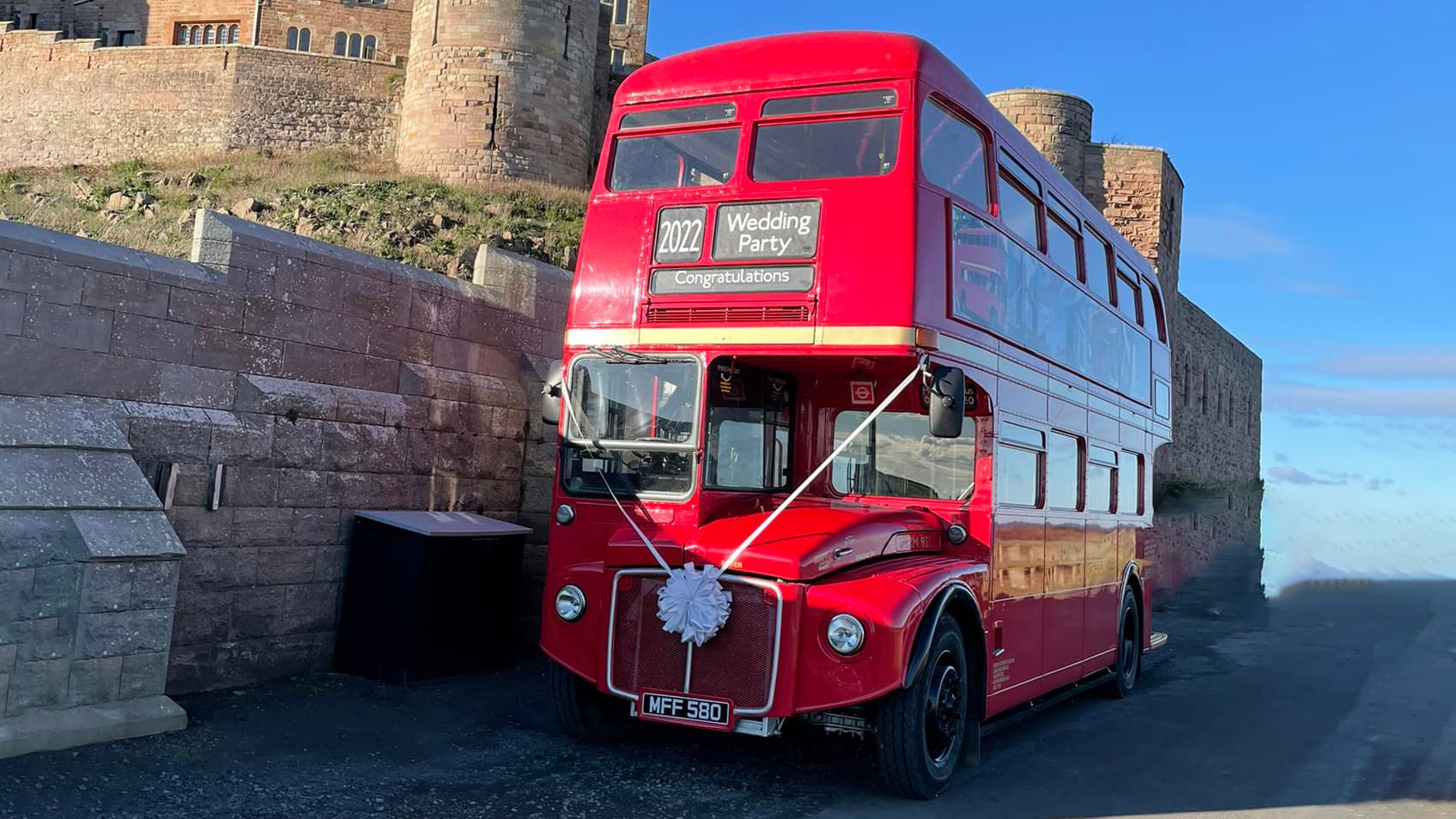 Double Decker Routemaster Bus parked in front of a wedding venue in Northumberland