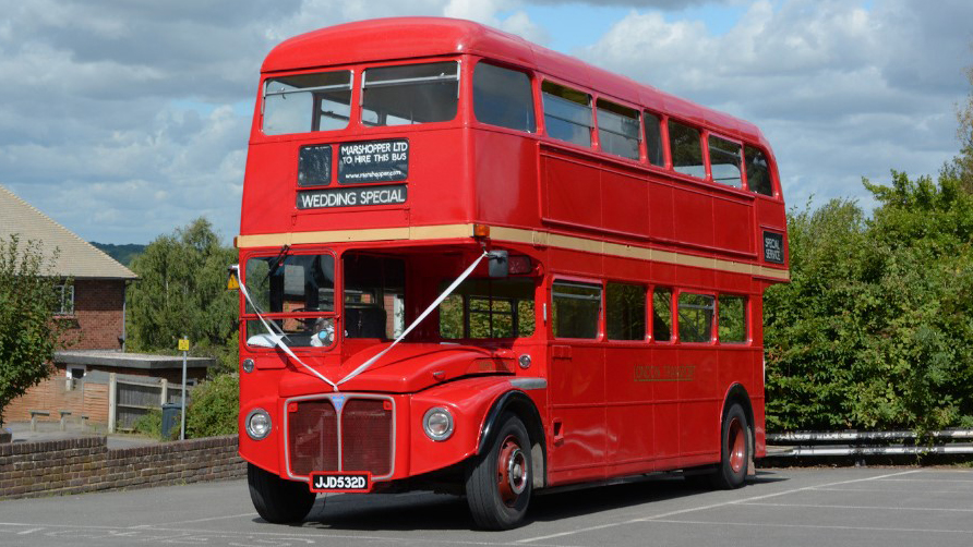 Vintage Red Routemaster Bus with White Wedding Ribbons