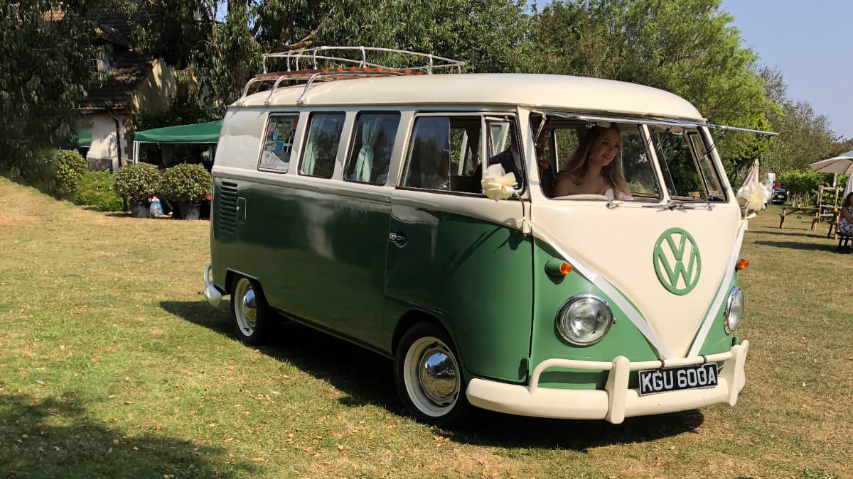 Front rioght view of a classic campervan in Green and White