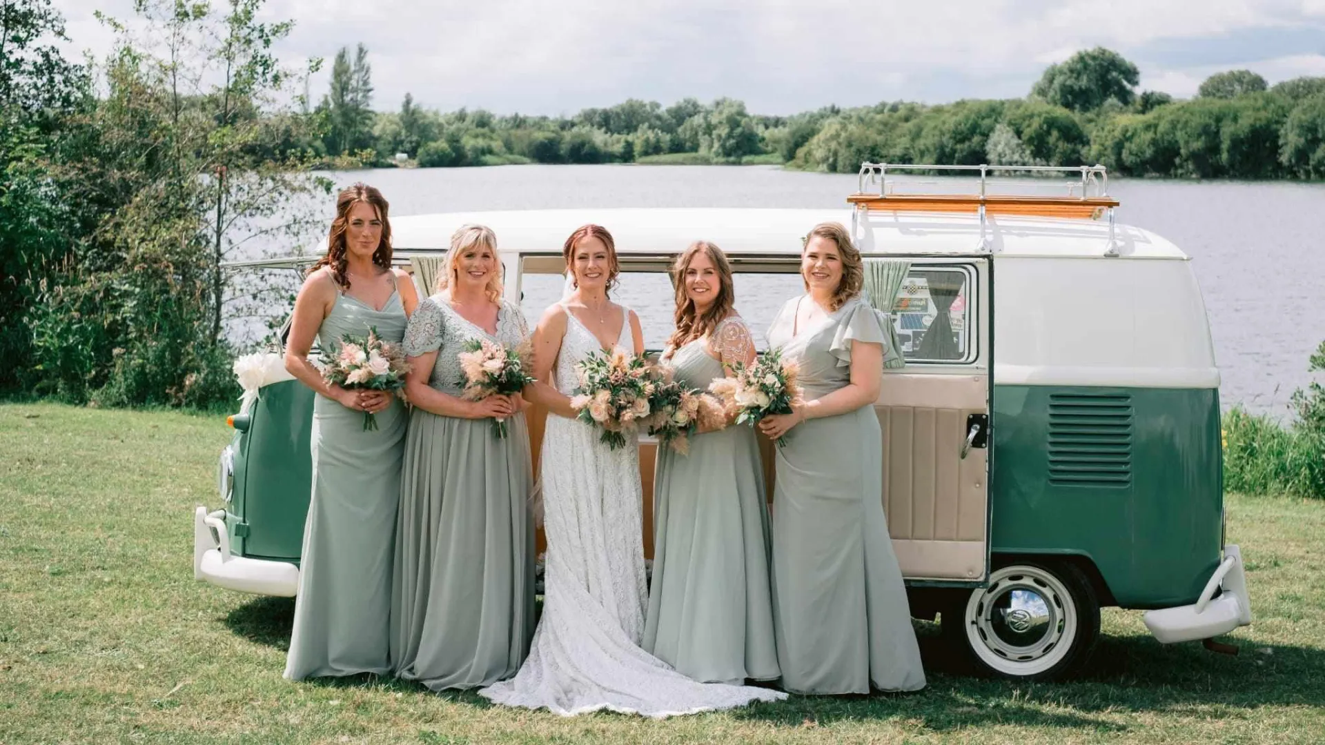 Birde wearing a white dress with her 4 Bridesmaids wearing a pastel green matching dresses in front of a Classic VW Campervan