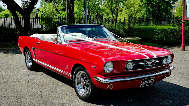 Classic Ford Mustang Convertible in Red with white ribbons