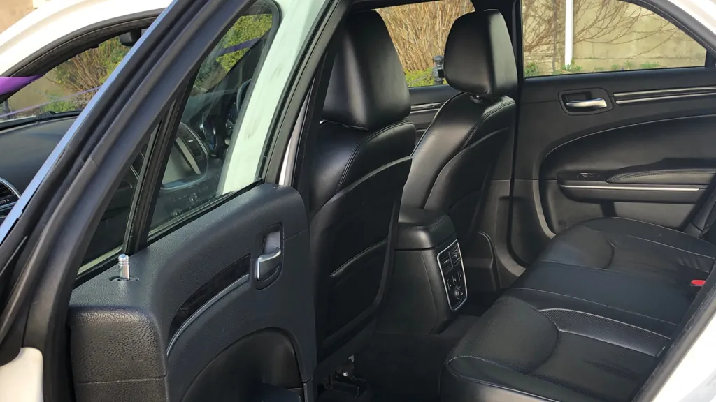 Black leather rear interior in a Chrysler 300c saloon car