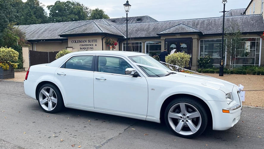 Right side view of White Chrysler 300c Saloon Car