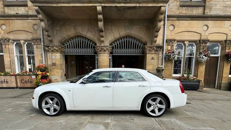 Left side view of White Chrysler 300c Saloon Car