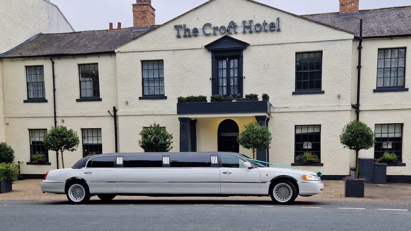 White Stretched lincoln limousine parked in frotn of the Croft Hotel in Durham