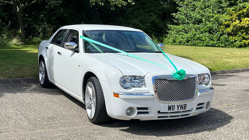 White Chrysler 300c Saloon Car with matching Aqua Green Ribbons and bows