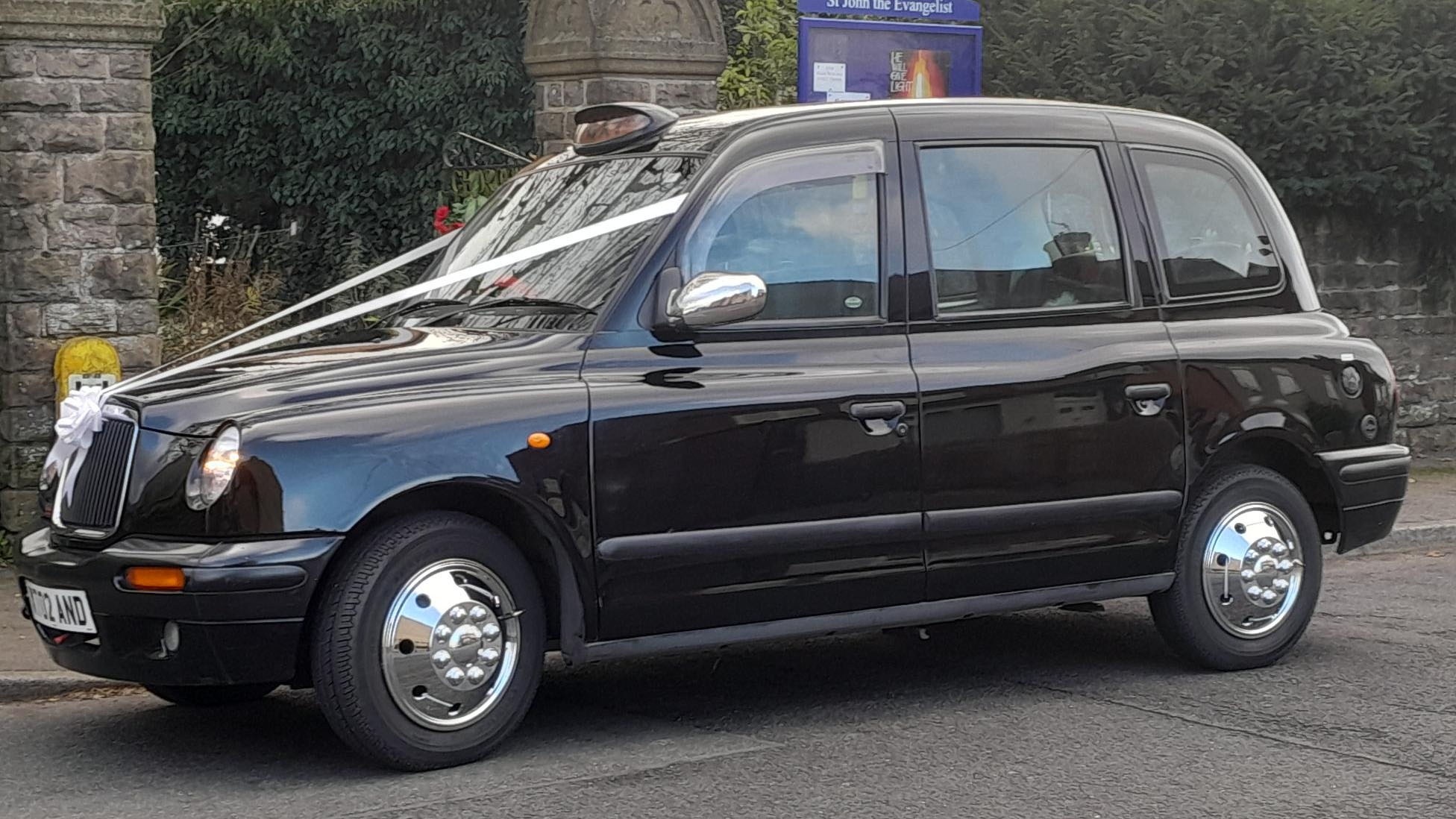 Left side view of Modern Black Taxicab