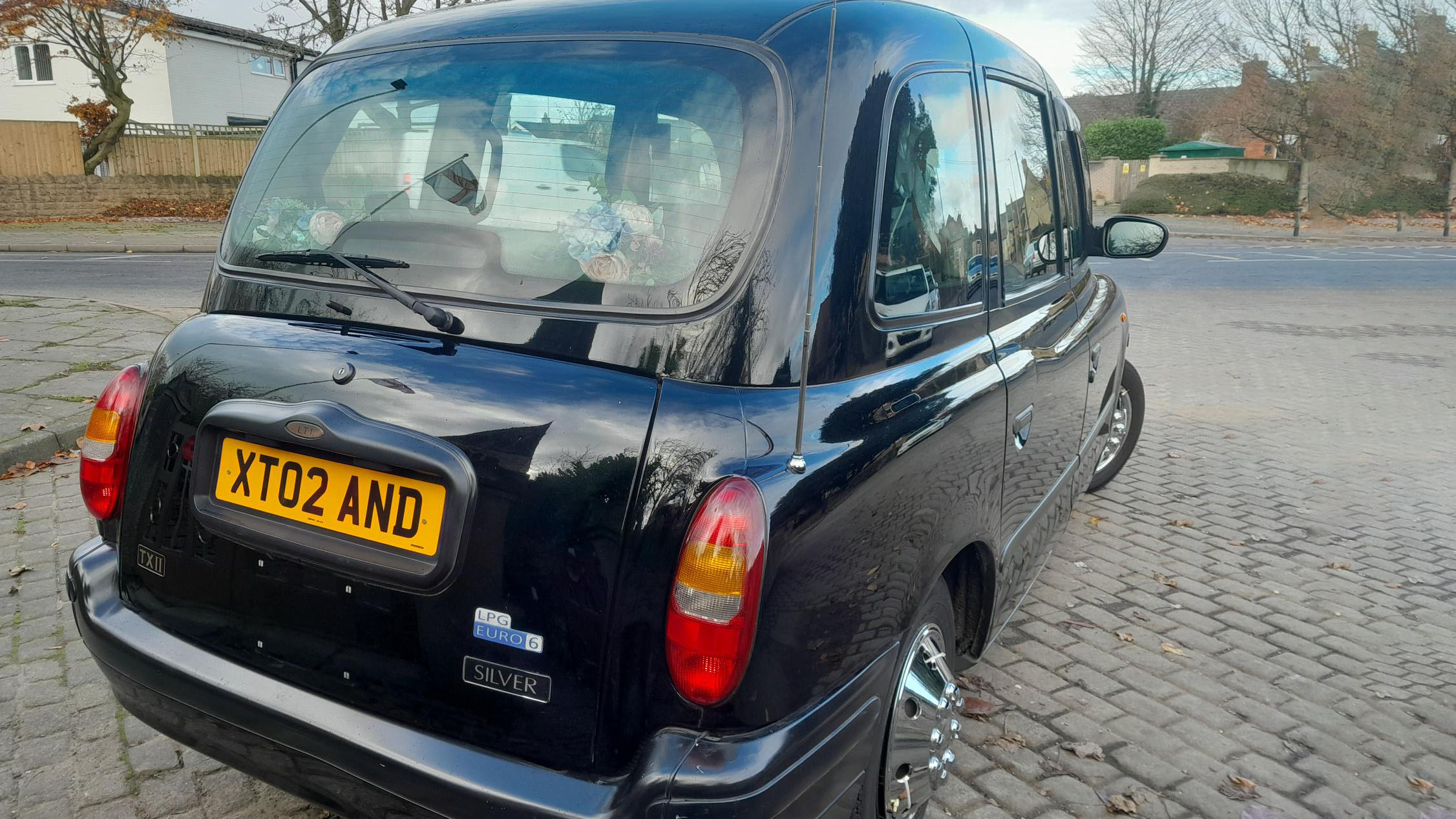 Rear view of Modern Black Taxi Cab