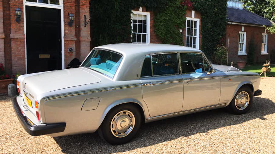 classic Rolls-Royce Silver Shadow parked in front of a wedding venue in Essex