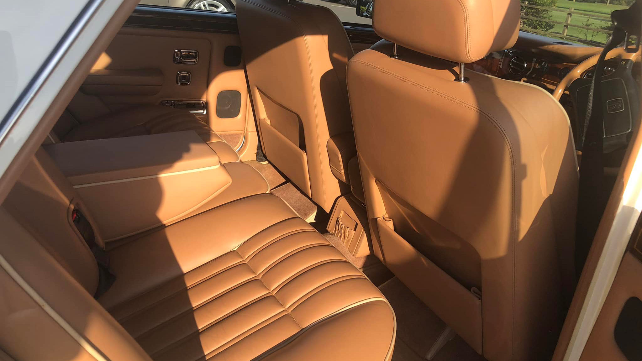 rear interior tan leather inside a classic Rolls-Royce Silver Spirit