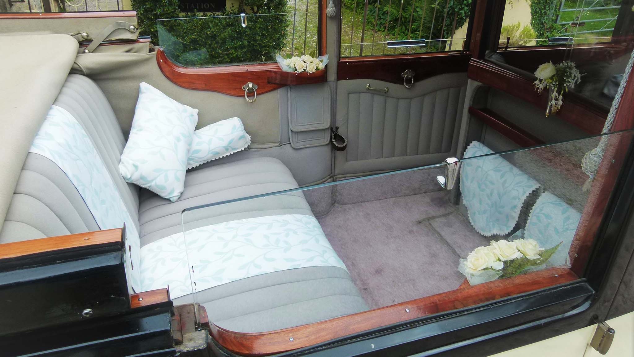 aerial view of the rear interior through the opened up convertible roof of a Daimler limousine