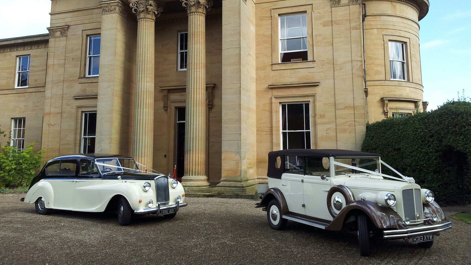 Classic and a Vintage Wedding Car parked in front of Longhirst Hall near Newcastle-upon-tyne