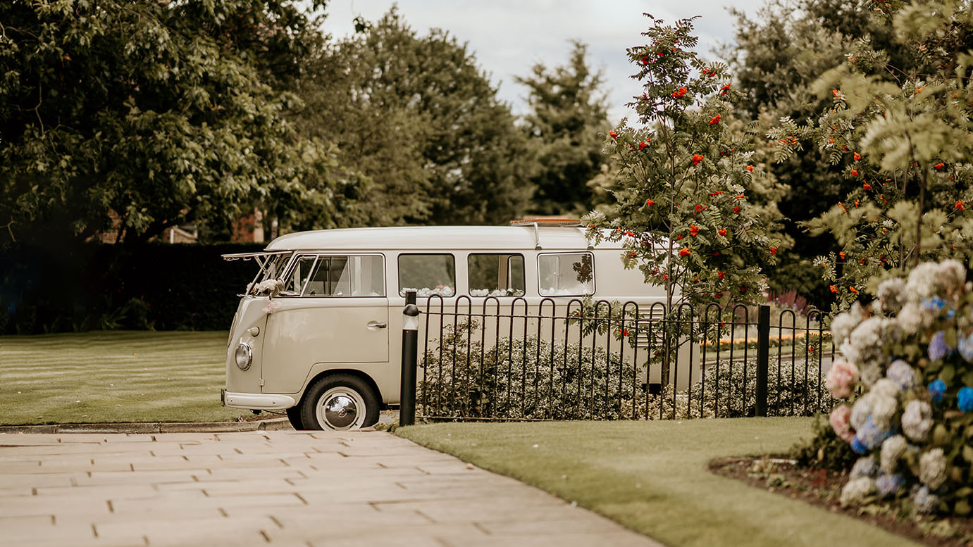 Classic campervan parked in front of wedding venue in Nottingham