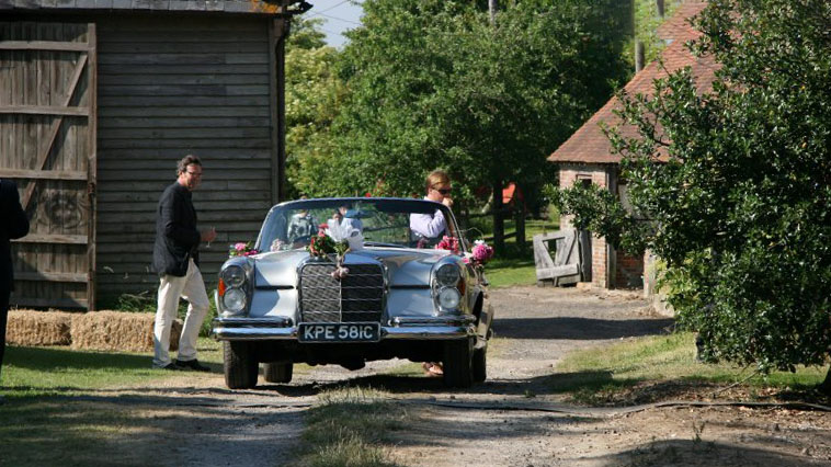 Classic Mercedes leaving wedding venue