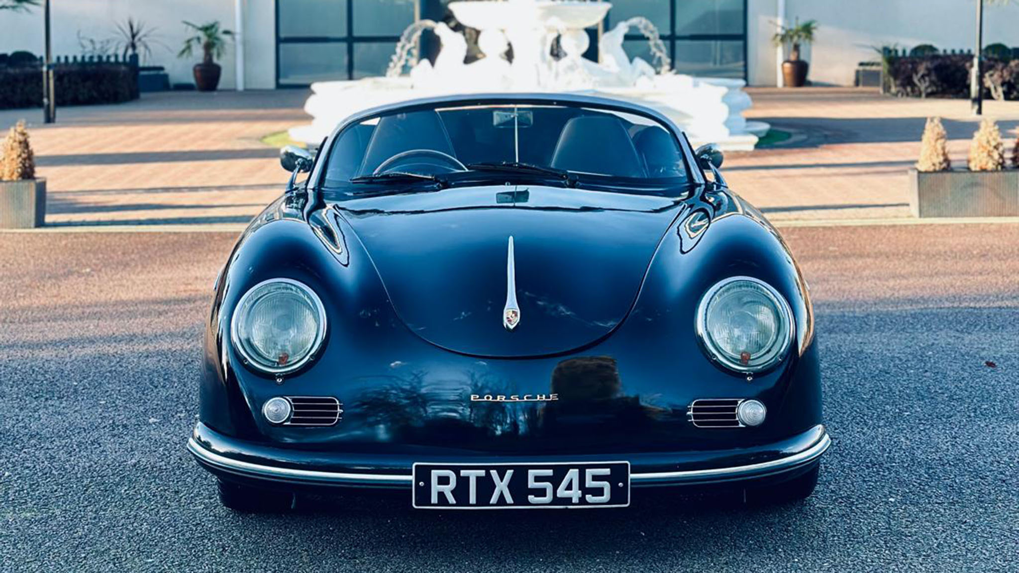 Frotn view of Black Porsche Convertible