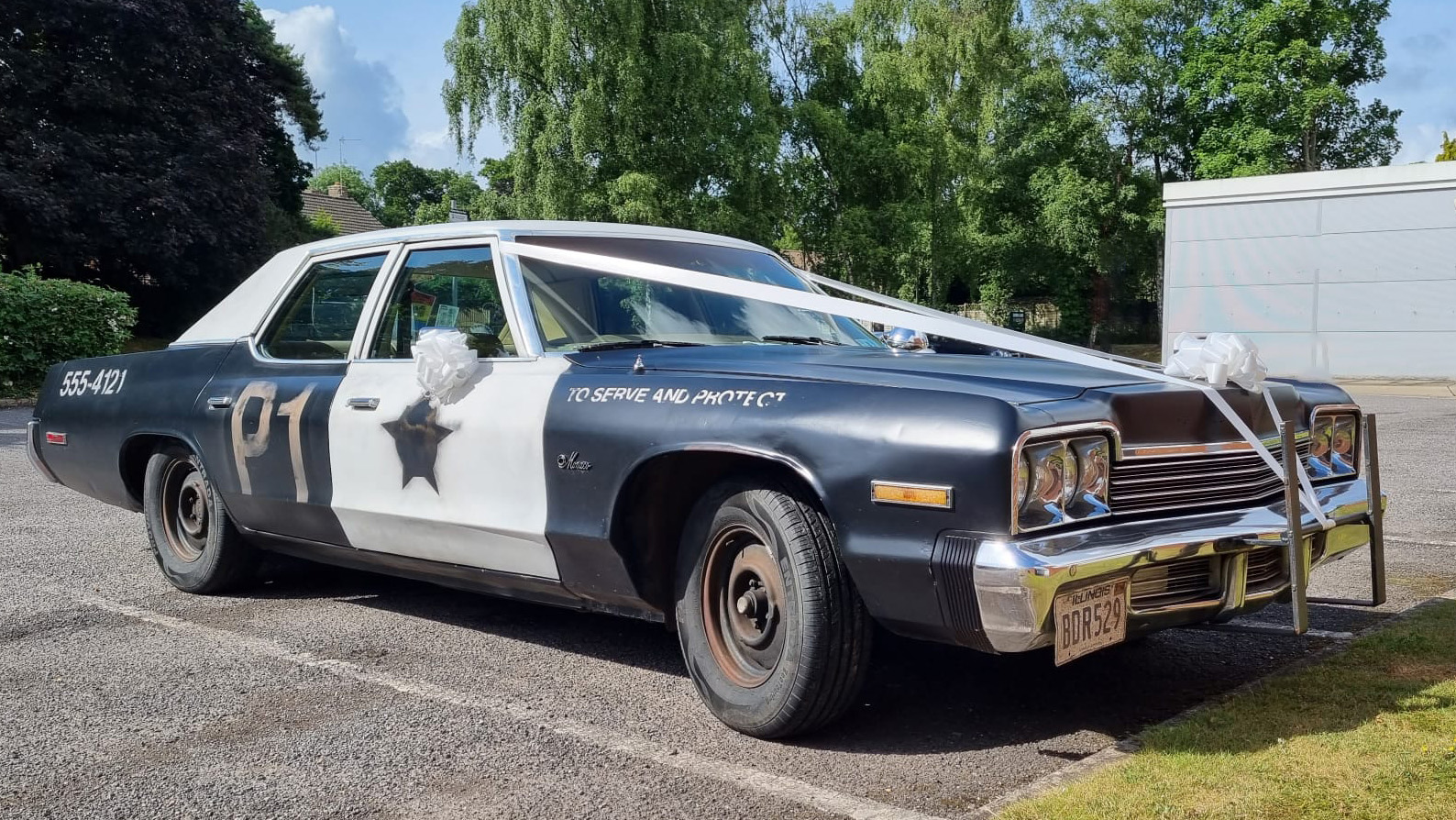 Bluesmobile with white ribbons