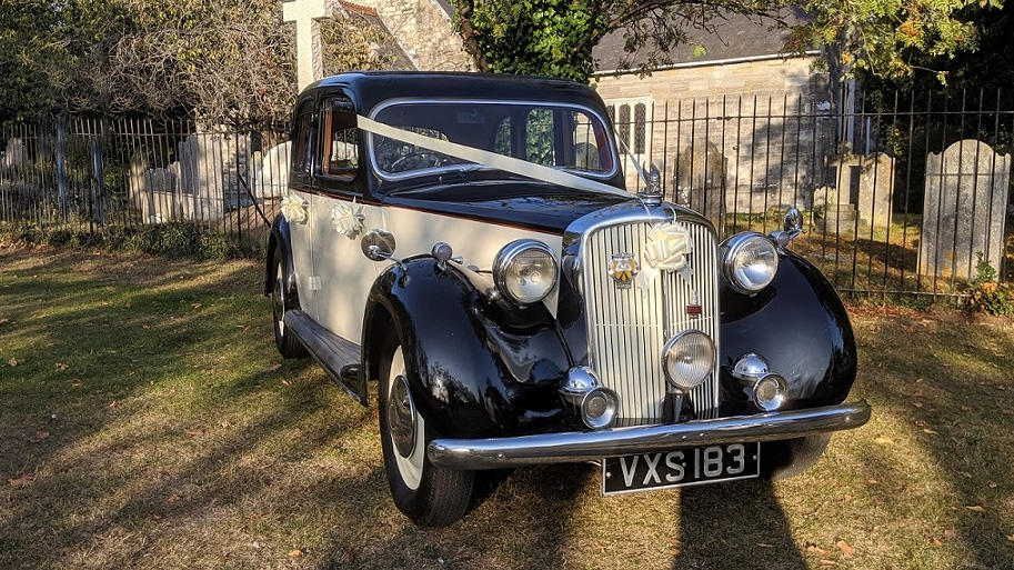 black and Ivory Rover p3 in front of a church