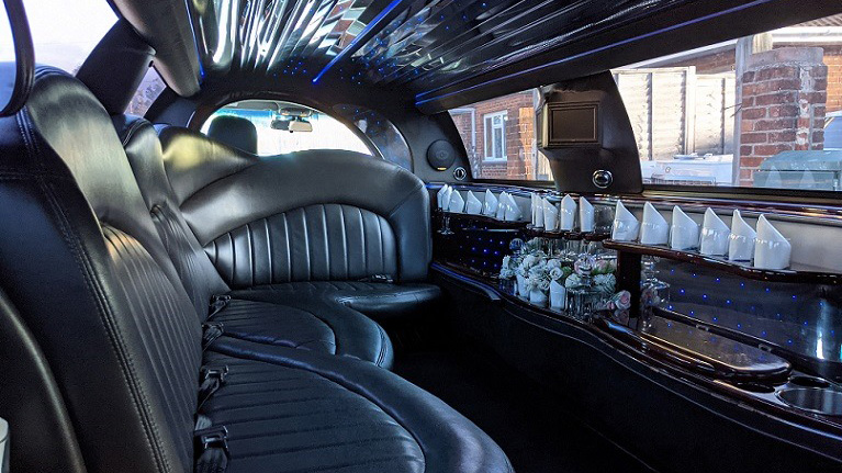 Black leather interior seat inside  Stretched limousine with cocktail bar