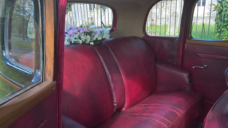 Burgundy leather seat inside a Rover p3