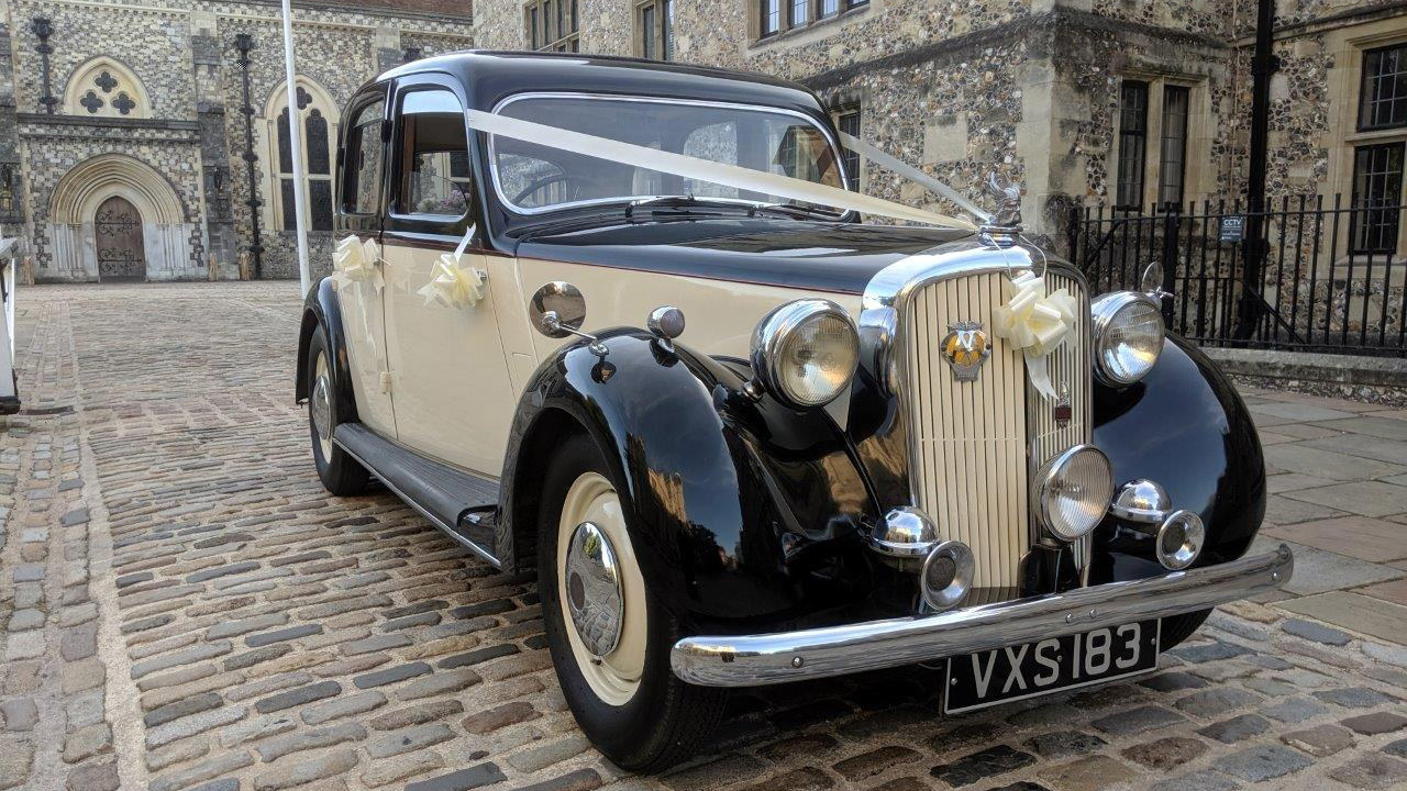 vintage Rover p3in Ivory with black wheel arches and roof decorated with ivory weding ribbon