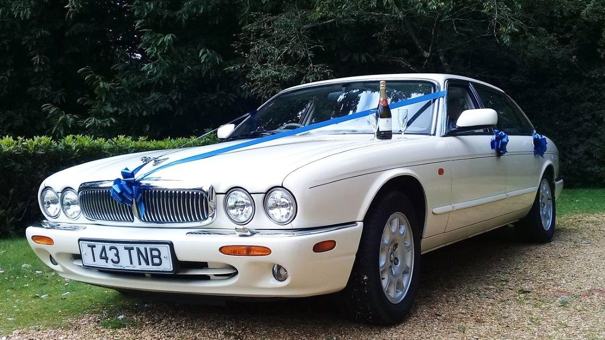 Royal Blue ribbons and bows on a white modern car