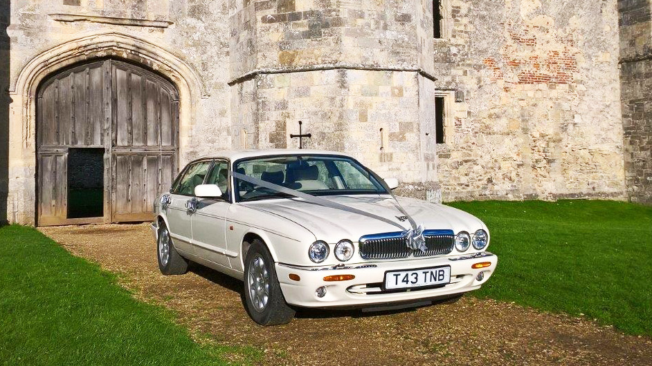 White Jaguar wedding car