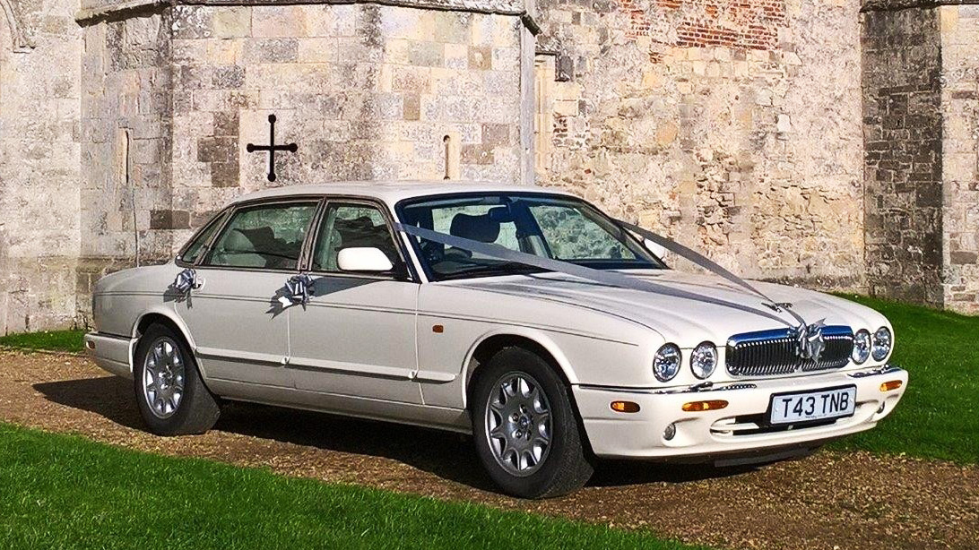 White Jaguar wedding car