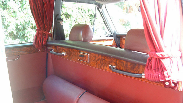 Glass division between passengers and driver inside a classic Daimler Limousine