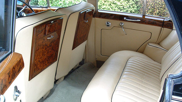 Rear interior cream leather seat with wooden picnic table