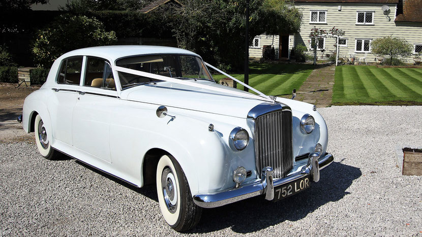 Classic White Bentley S1 decorated with white wedidng ribbons