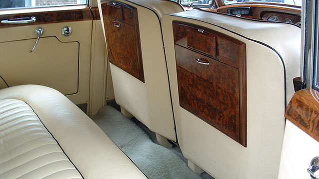 Rear interior cream leather seat with wooden picnic table