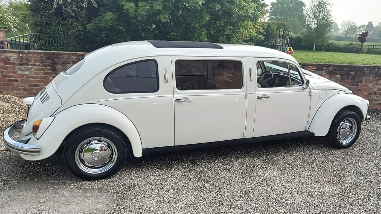 Right side view of Ivory Stretched beetle Limousine