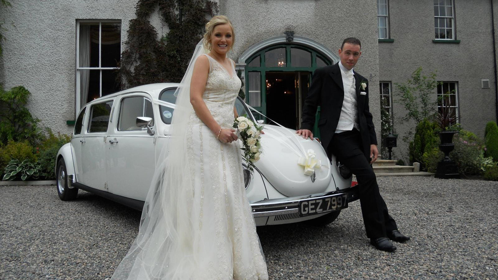 Bride and Groom with Classic Stretched Beetle Limousine