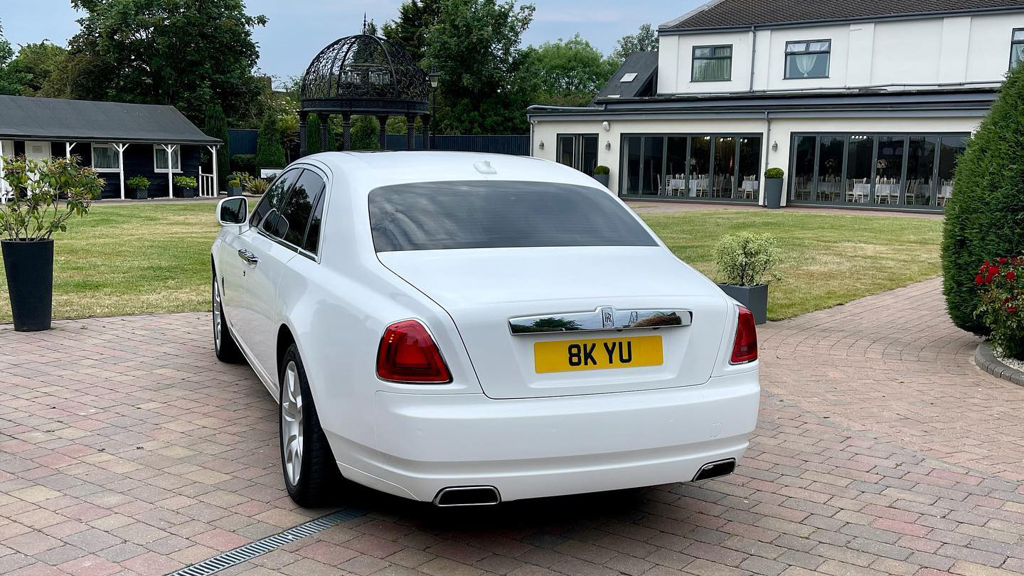 Rear view of a White rolls-Royce Ghost