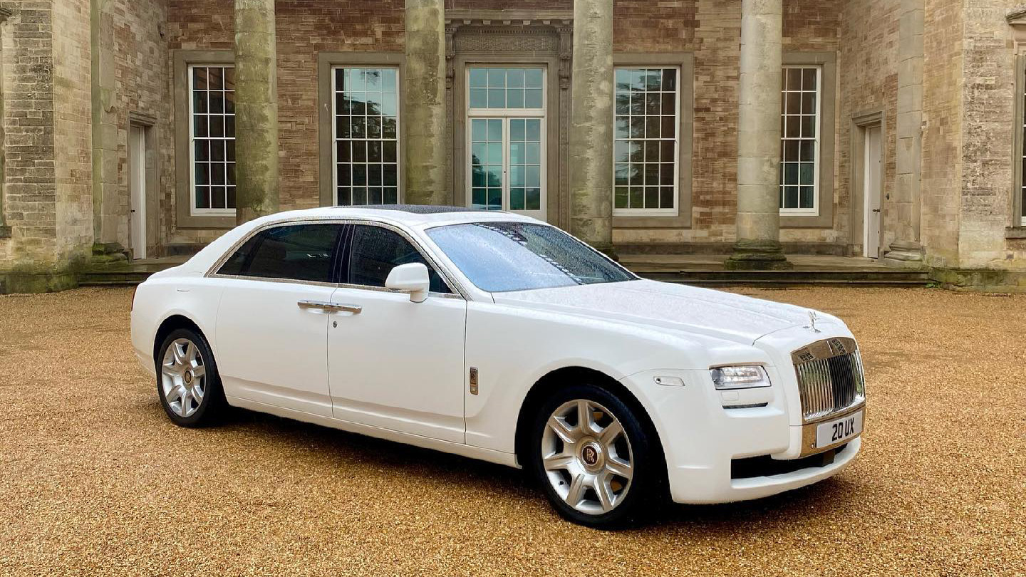 Right side view of white Rolls-Royce Ghost in front of wedding venue in Midlands