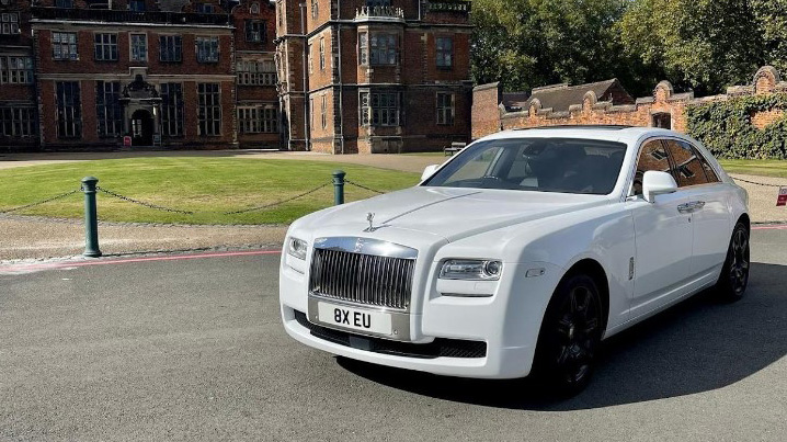 front left view of a Rolls-Royce Ghost in frotn of wedding venue in Birmingham