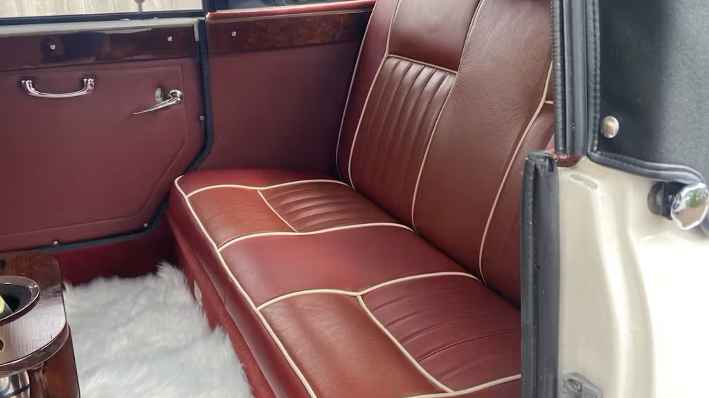 rear interior of a Beauford with Maroon leather seats