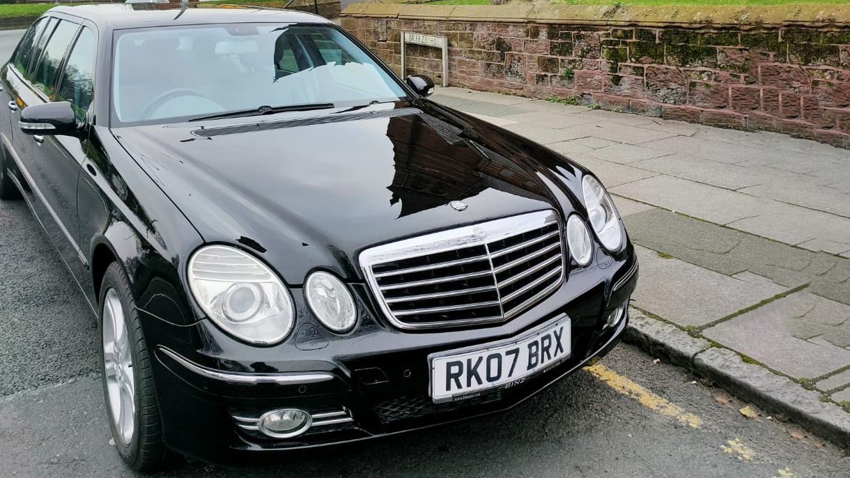 Black Mercedes e-class stretched limousine parked in the street of Liverpool