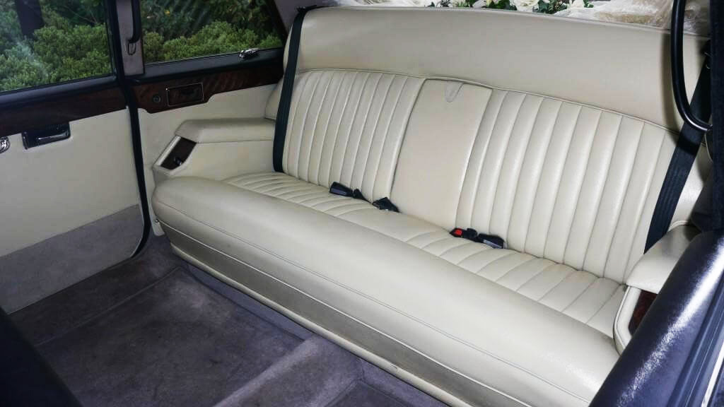 Rear interior forward facing bench seat inside Classic Daimler Limousine