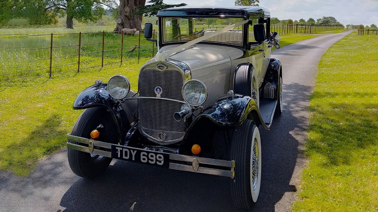 Front view of Badsworth Landaulette with wedding ribbons