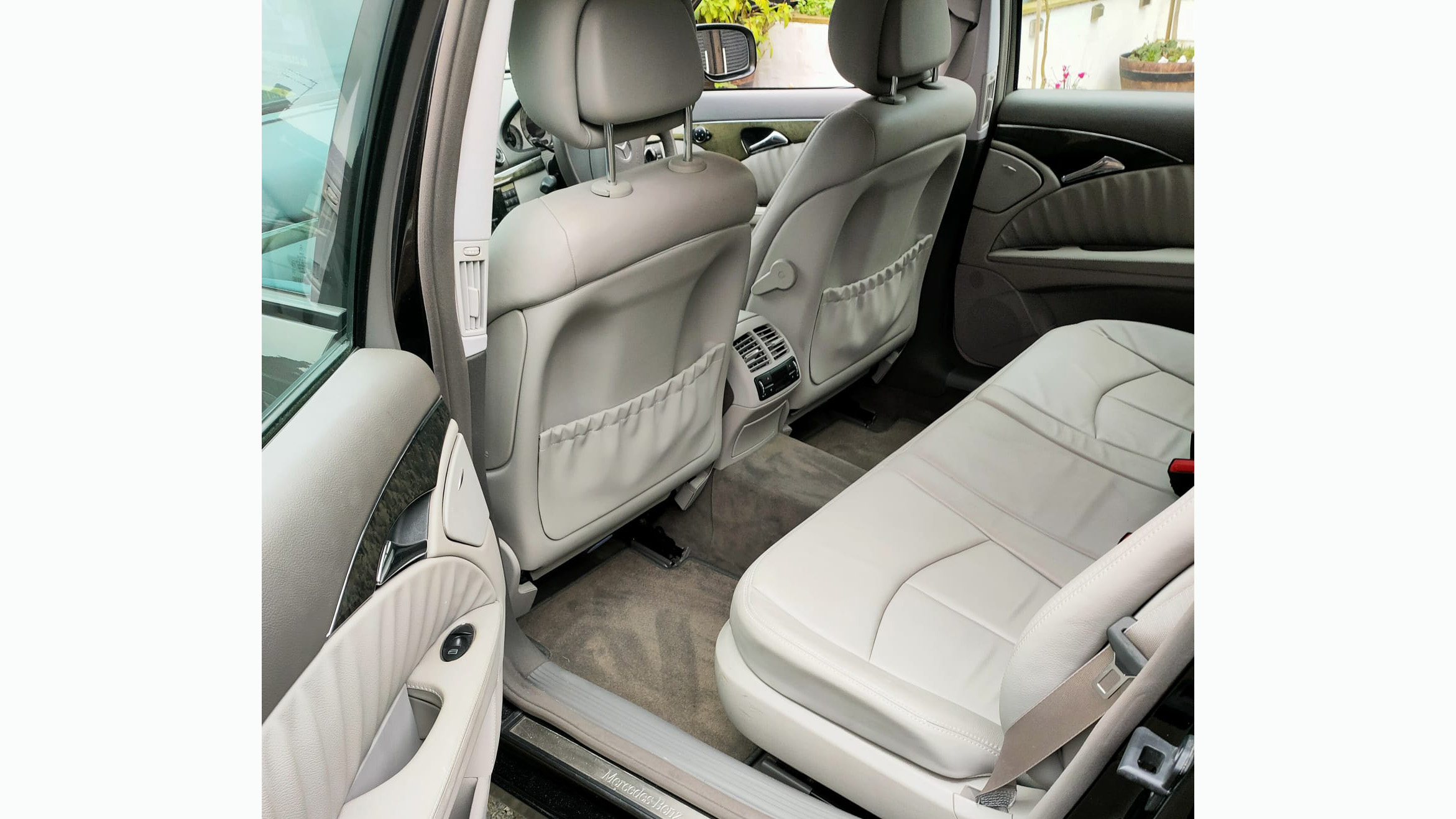 Middle row forward facing bench seat inside Mercedes Limousine