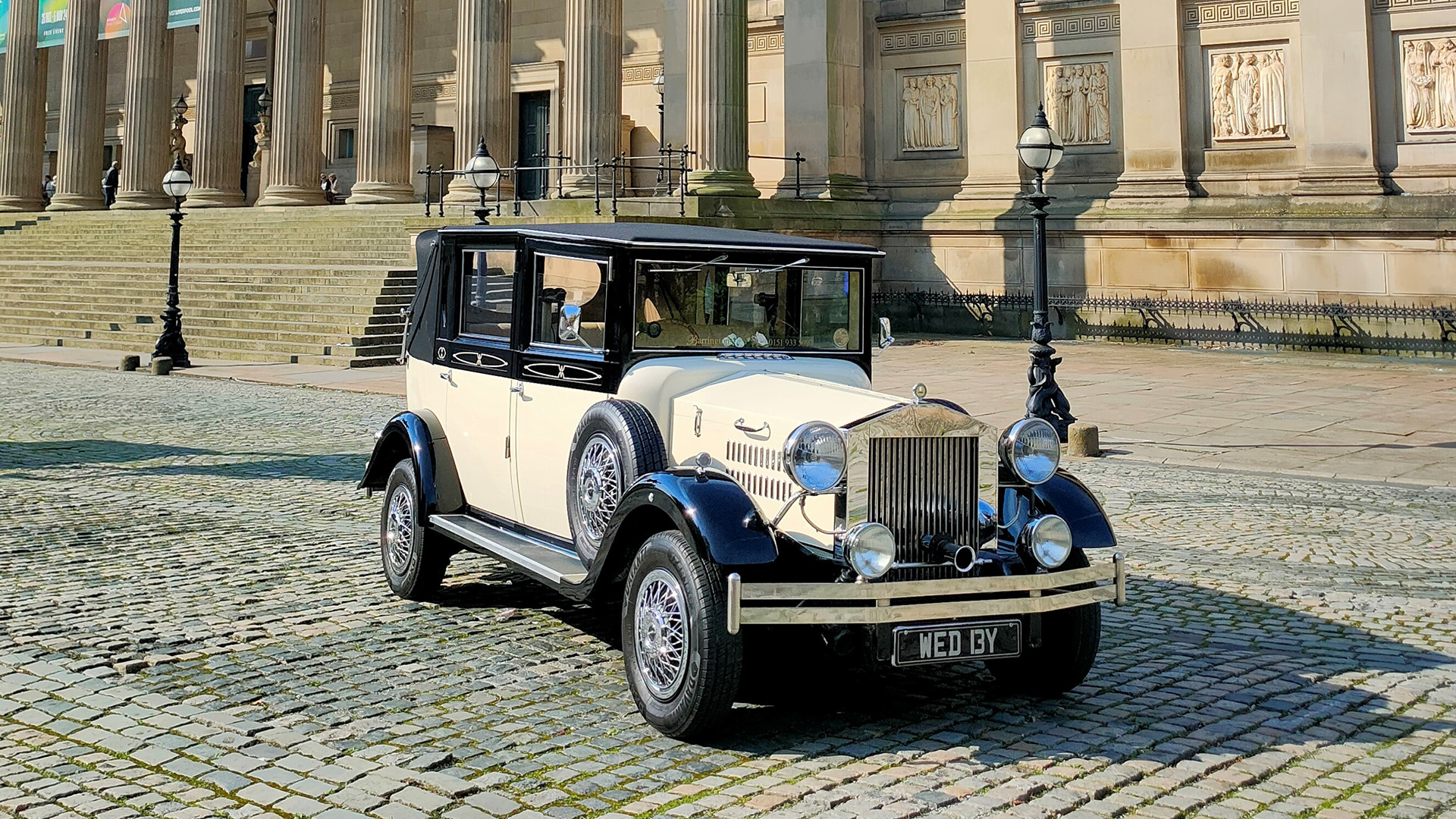 Imperial vintage car in Black and Ivory parked in front of St George Hall in Liverpool