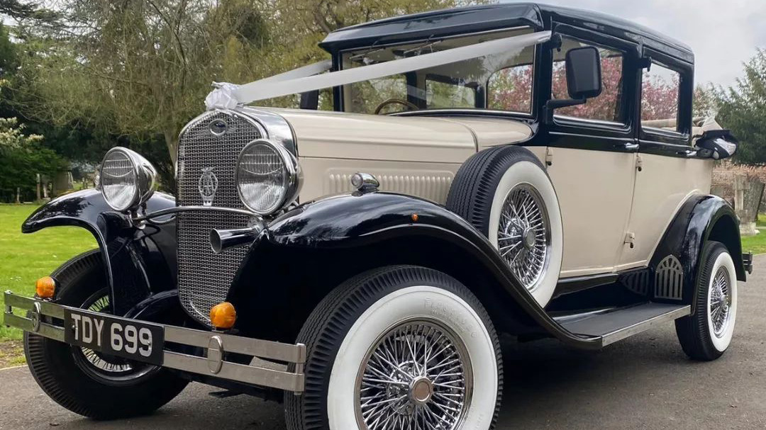 Badsworth Landaulette with white wedding ribbons, alloy spoke wheels