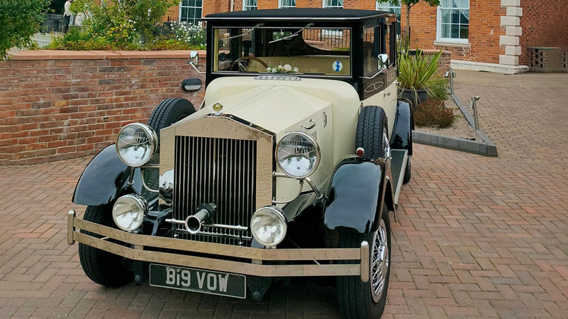 Front view of a vintage wedding car in Black & Ivory