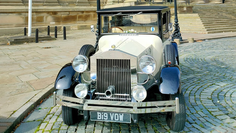 Front view of a vintage wedding car in Black & Ivory