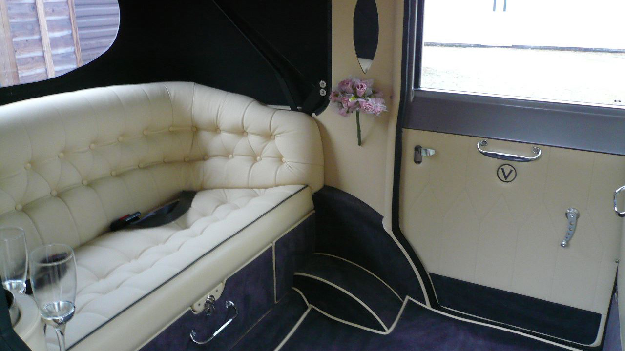 Cream leather interior with Royal Blue carpet inside a vintage Imperial wedding car