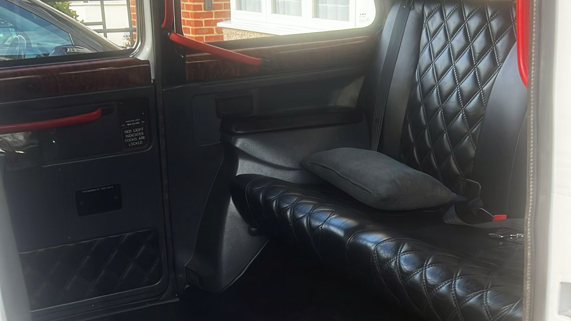 Rear compartment seat in black leather