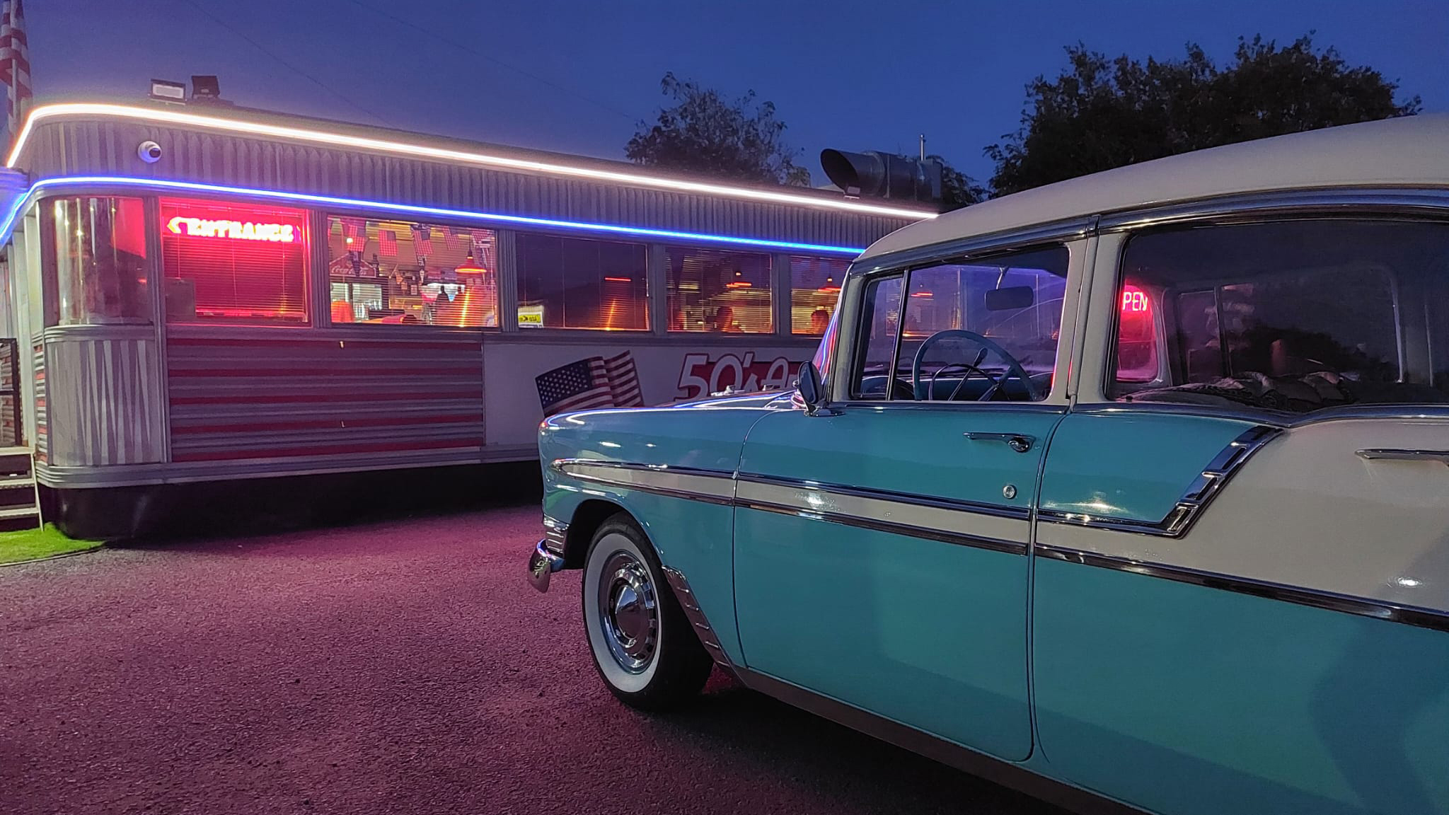 Classic American Chevrolet BelAir in Teal Blue and White parked outside an American Dinner.