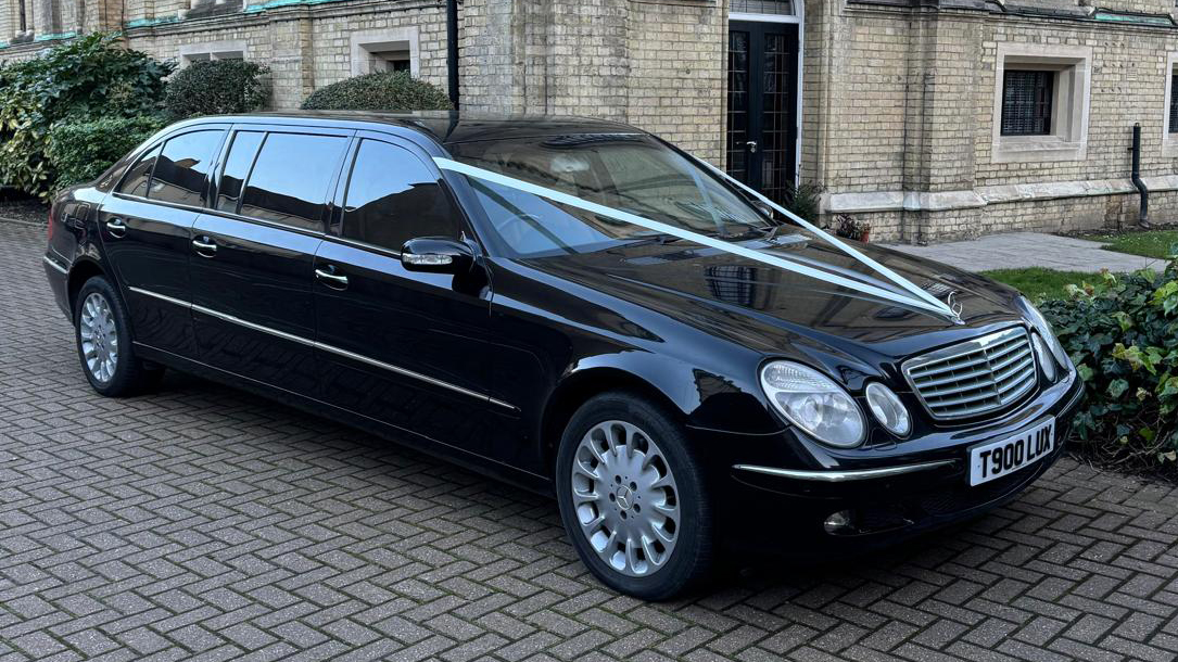 Black 7-seater Stretched Mercedes Limousine parked in the street of London