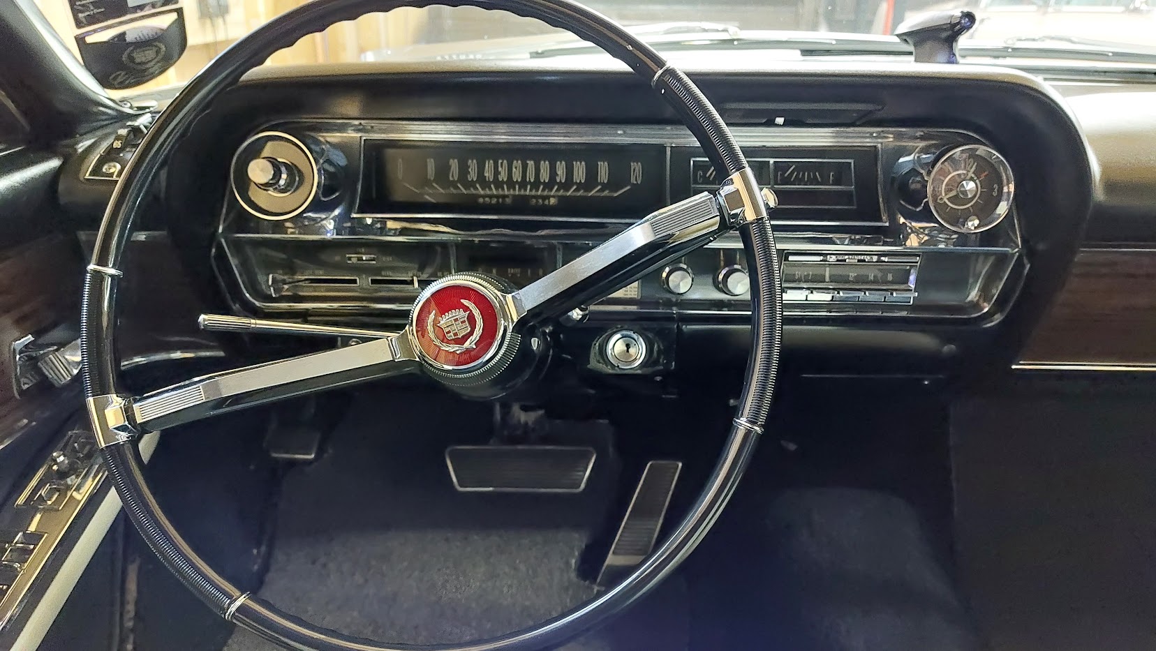 Front driver's dashboard and steering wheel inside Classic Cadillac